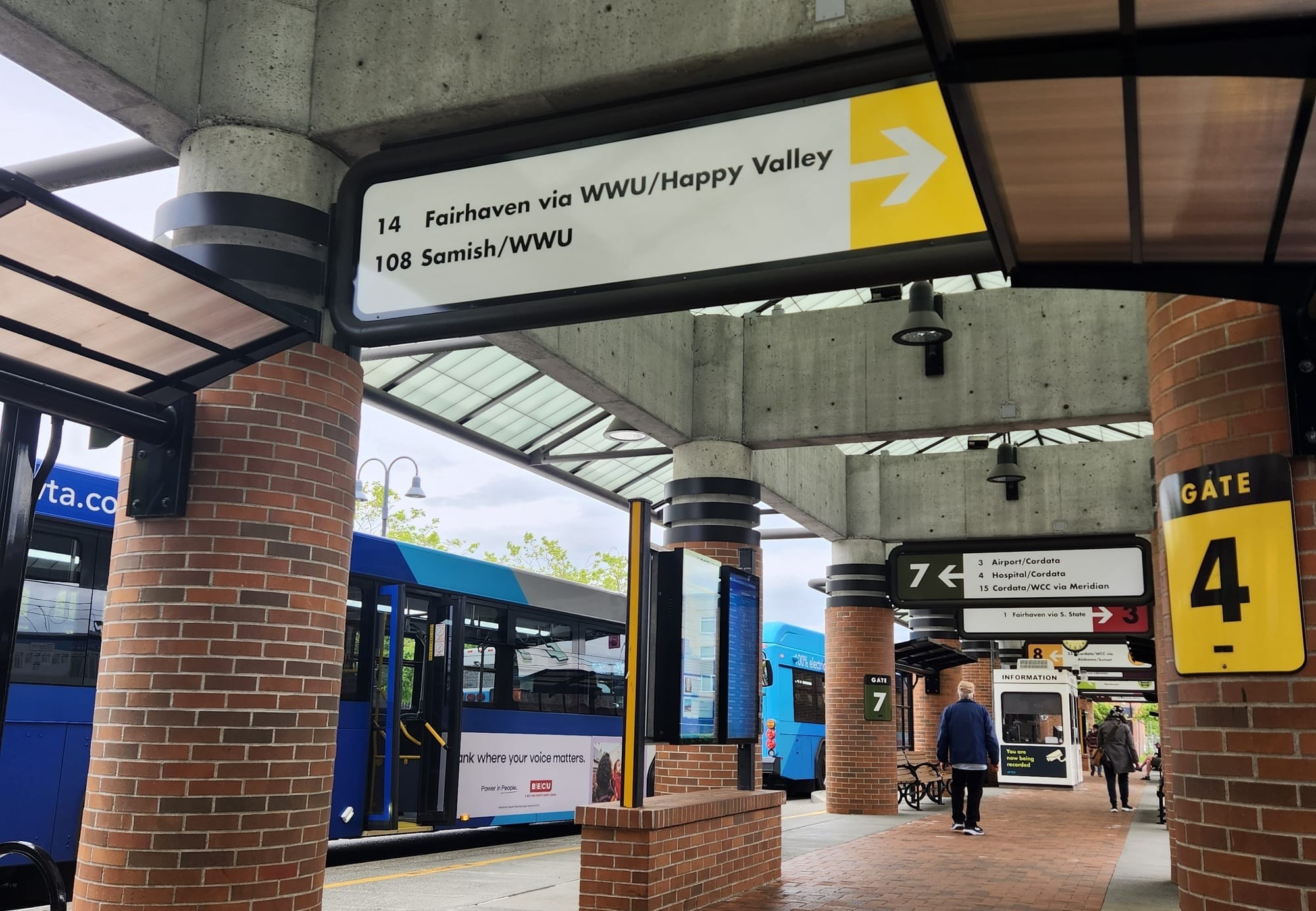A bus concourse with Gate 4, serving Routes 14 and 108, in the foreground.