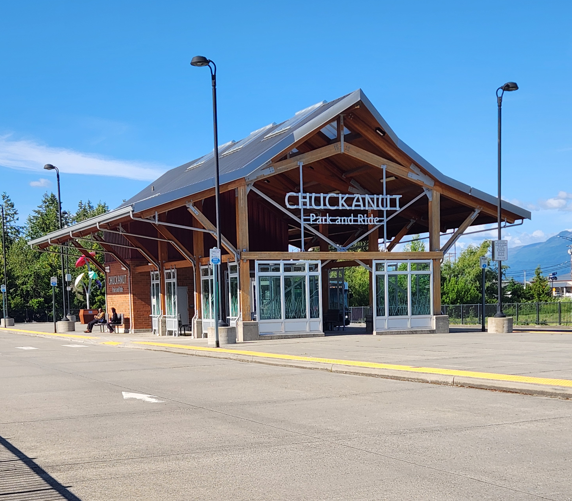 A transit center with peaked timber framing.