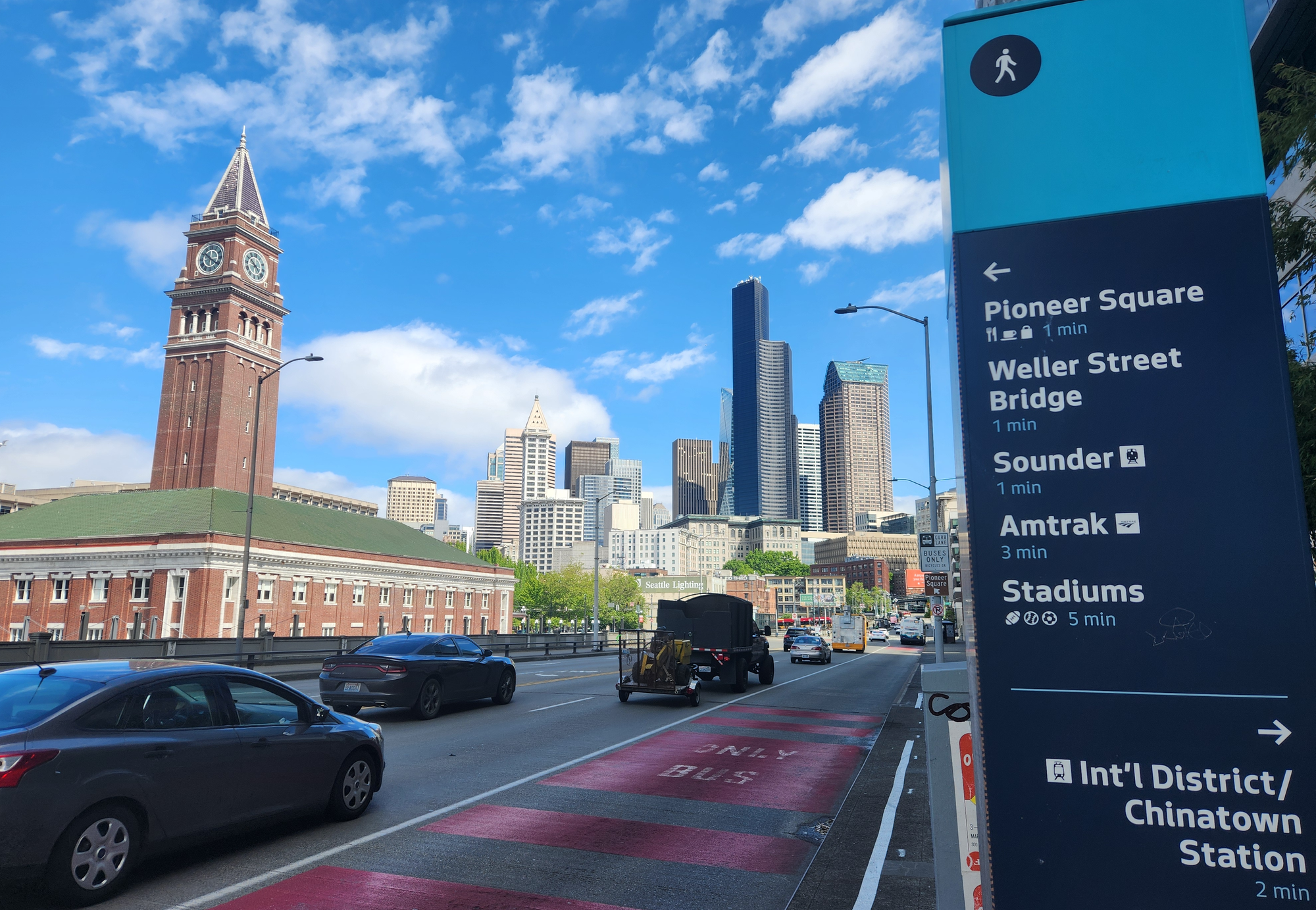 A photo of King Street Station with Seattle's downtown skyline in the background.