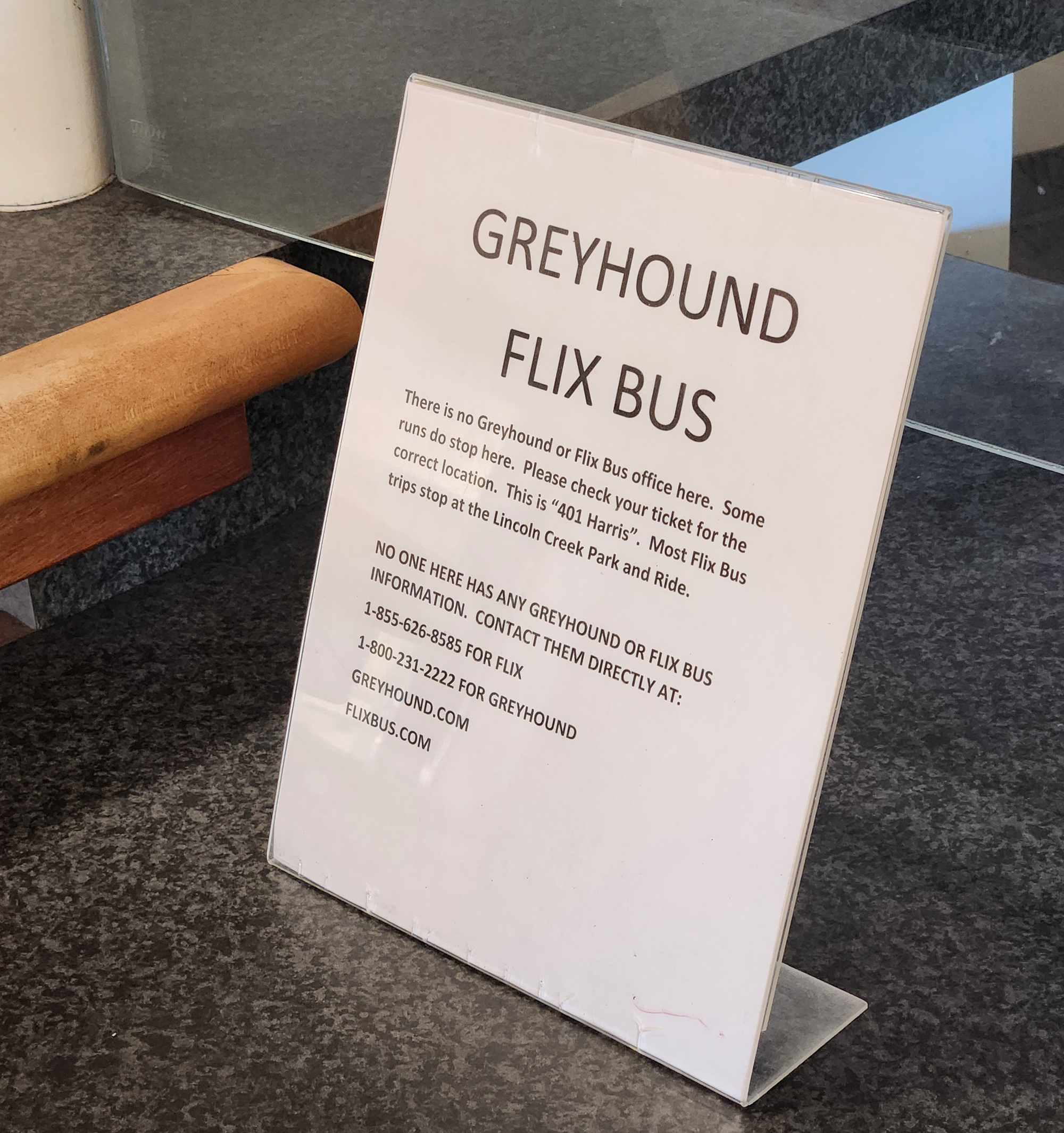 A sign reading: "There is no Greyhound or Flix Bus office here. Some runs do stop here. Please check your ticket for the correct location. This is "401 Harris". Most Flix Bus trips stop at the Lincoln Creek Park and Ride."&nbsp; "NO ONE HERE HAS ANY GREYHOUND OF FLIX BUS INFORMATION."