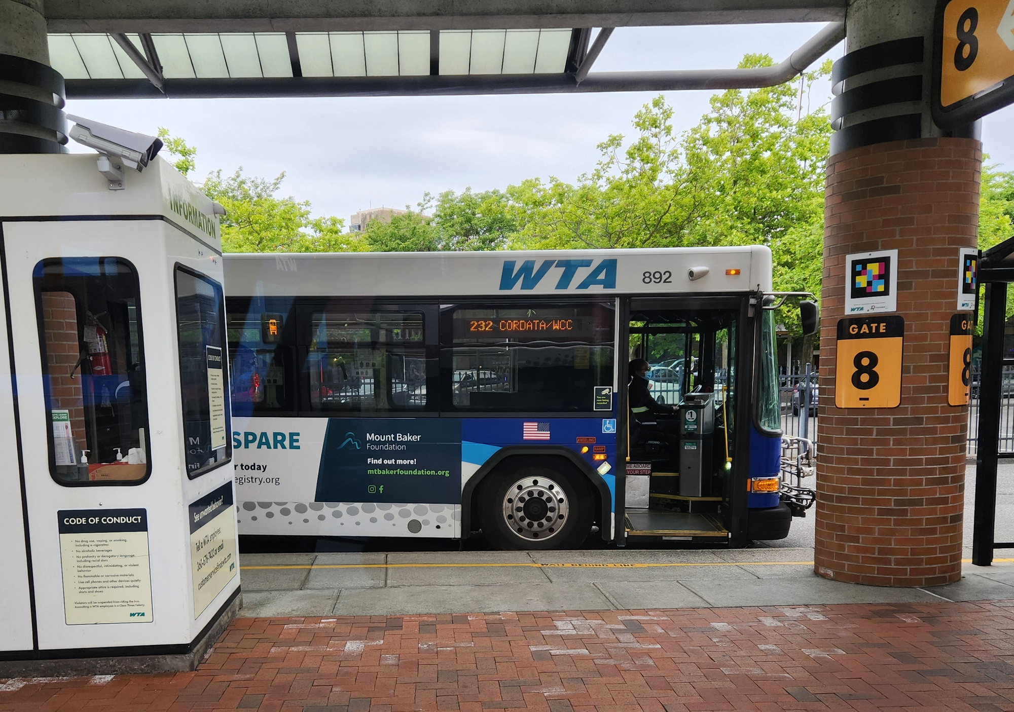 A WTA bus, Route 232 to Cordata/WCC) is parked at Gate 8.