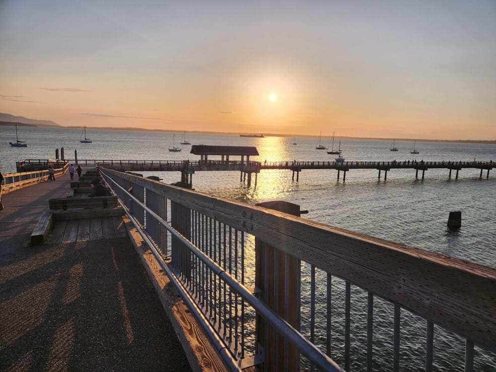 Taylor Dock and the overwater boardwalk section of the South Bay Trail heading toward sunset.