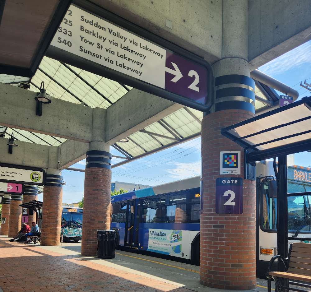 A WTA bus sits at Gate 2 at a transit center.