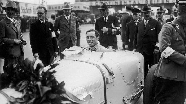 Berlin, 1933, Pierre Veyron conquers the AVUS track in his Bugatti T51A, further cementing his place in racing history.​
