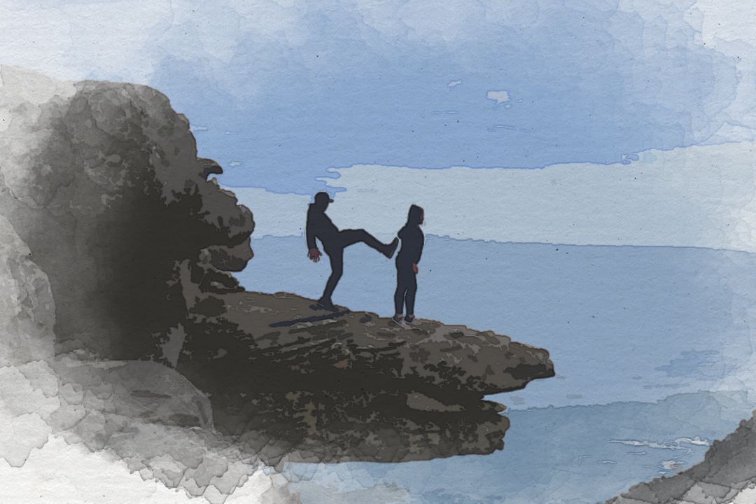 man about to kick woman standing on cliff