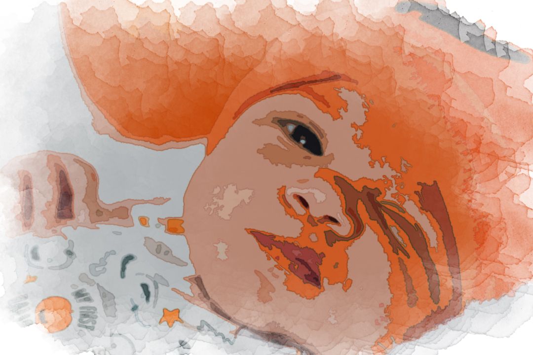 baby wearing orange knit cap