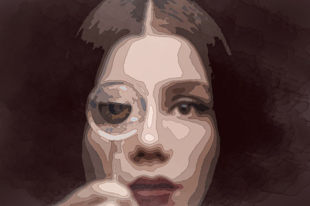 woman looking through magnifying glass