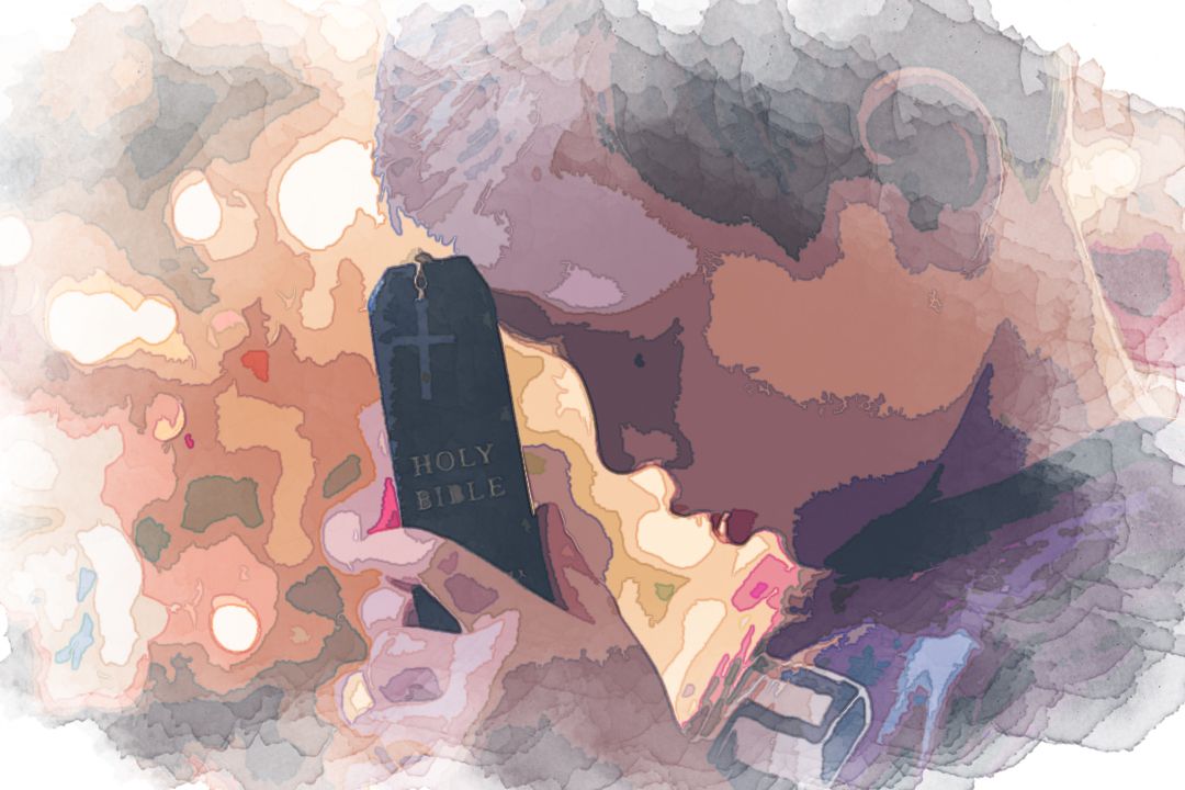 boy holding Holy Bible