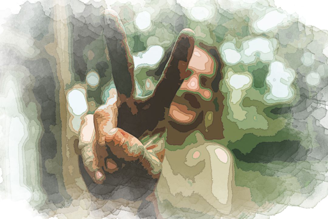 person doing peace sign