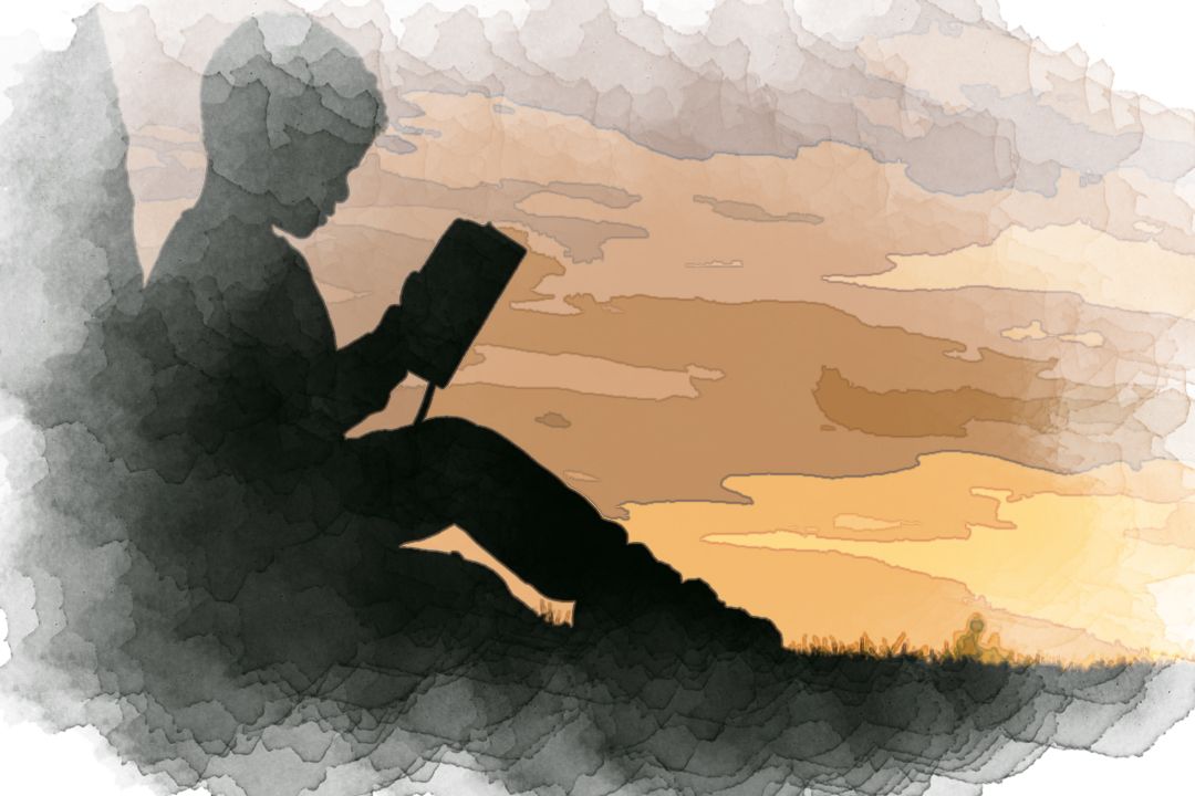 silhouette of child sitting behind tree during sunset