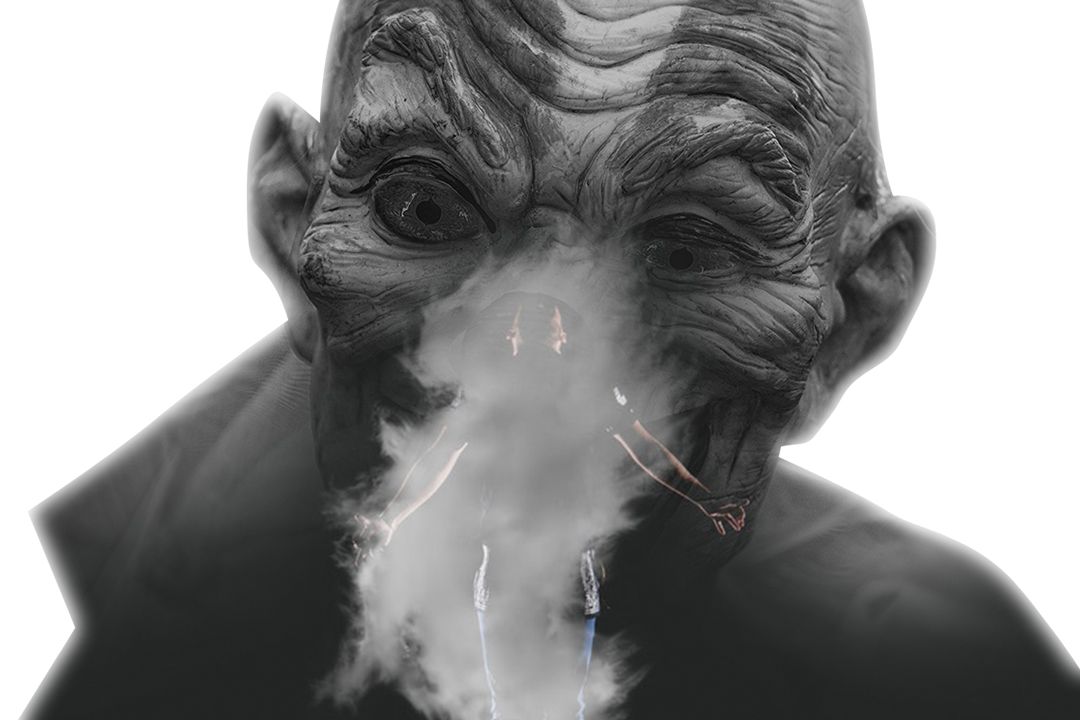 person standing near smoke with black background