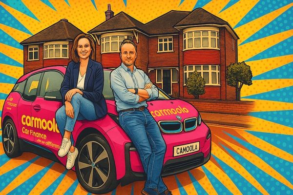 Carmoola co-founders Amy McKechnie and Aidan Rushby pictured with the company’s signature pink electric car in suburban London