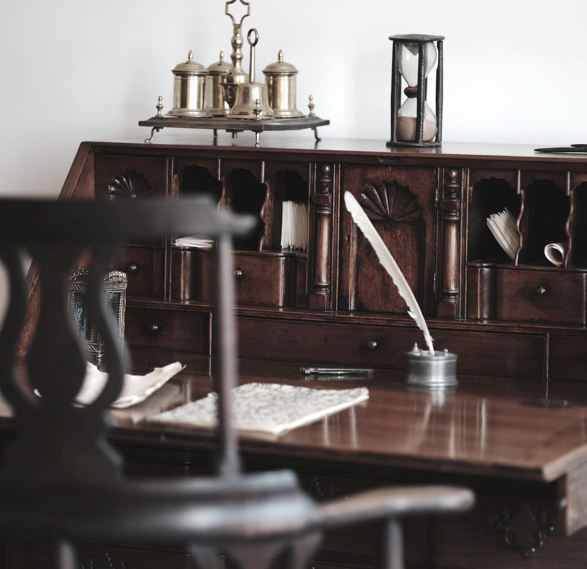 Antique wooden desk with quill and inkwell.