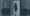A woman who works for a family office walking through a doorway.