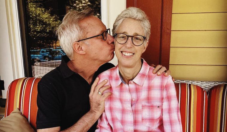 Steven Petrow and his now late sister Julie, he plants a kiss on her cheek.