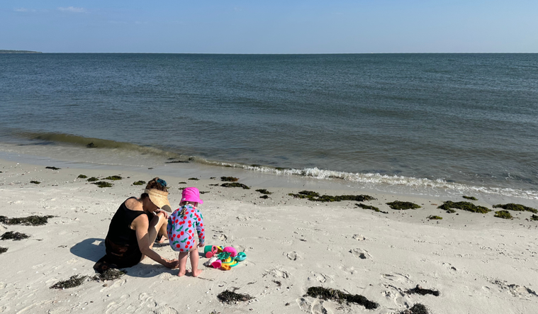 Maria and her granddaughter at the beach.