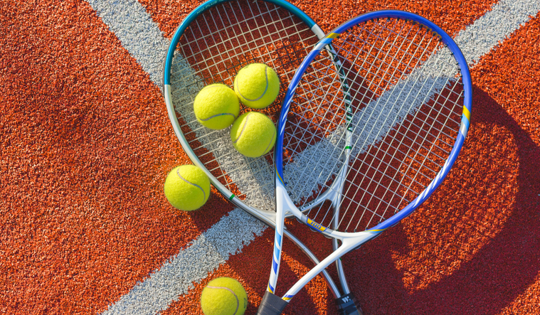 Tennis racket and balls.