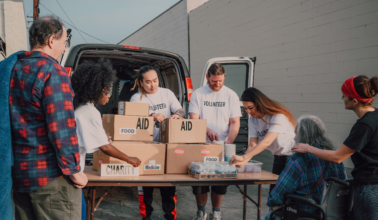 Volunteers help distribute aid