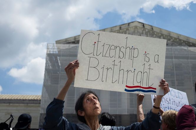 Woman protesting holds up a sign titled "citizenship is a birthright." Washington, D.C., May 15, 2025. Photo by Allison Bailey/NurPhoto via AP.