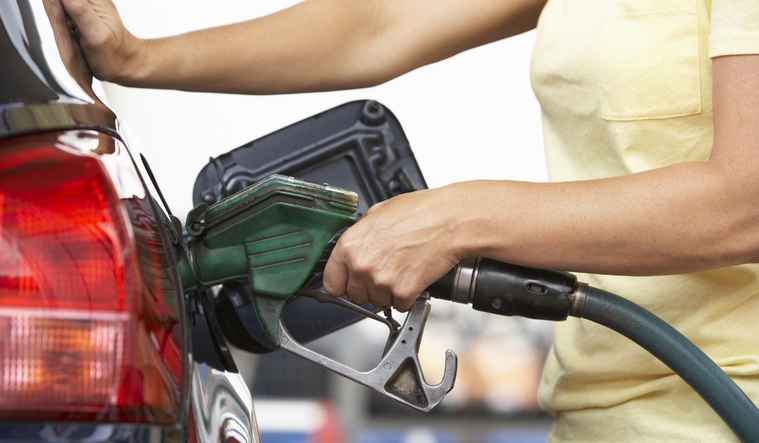 Woman pumping gas