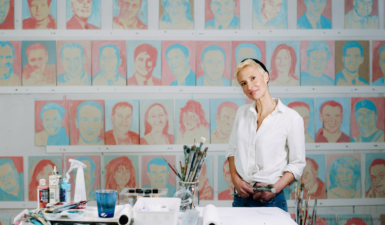 Katie Ré Scheidt with her portraits