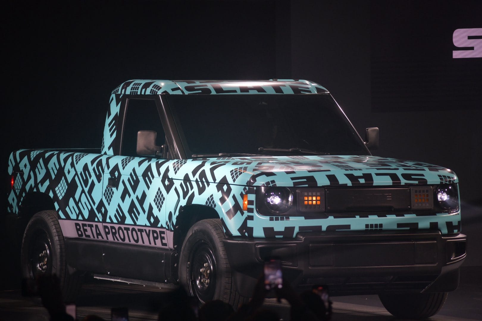 A light blue and black truck.