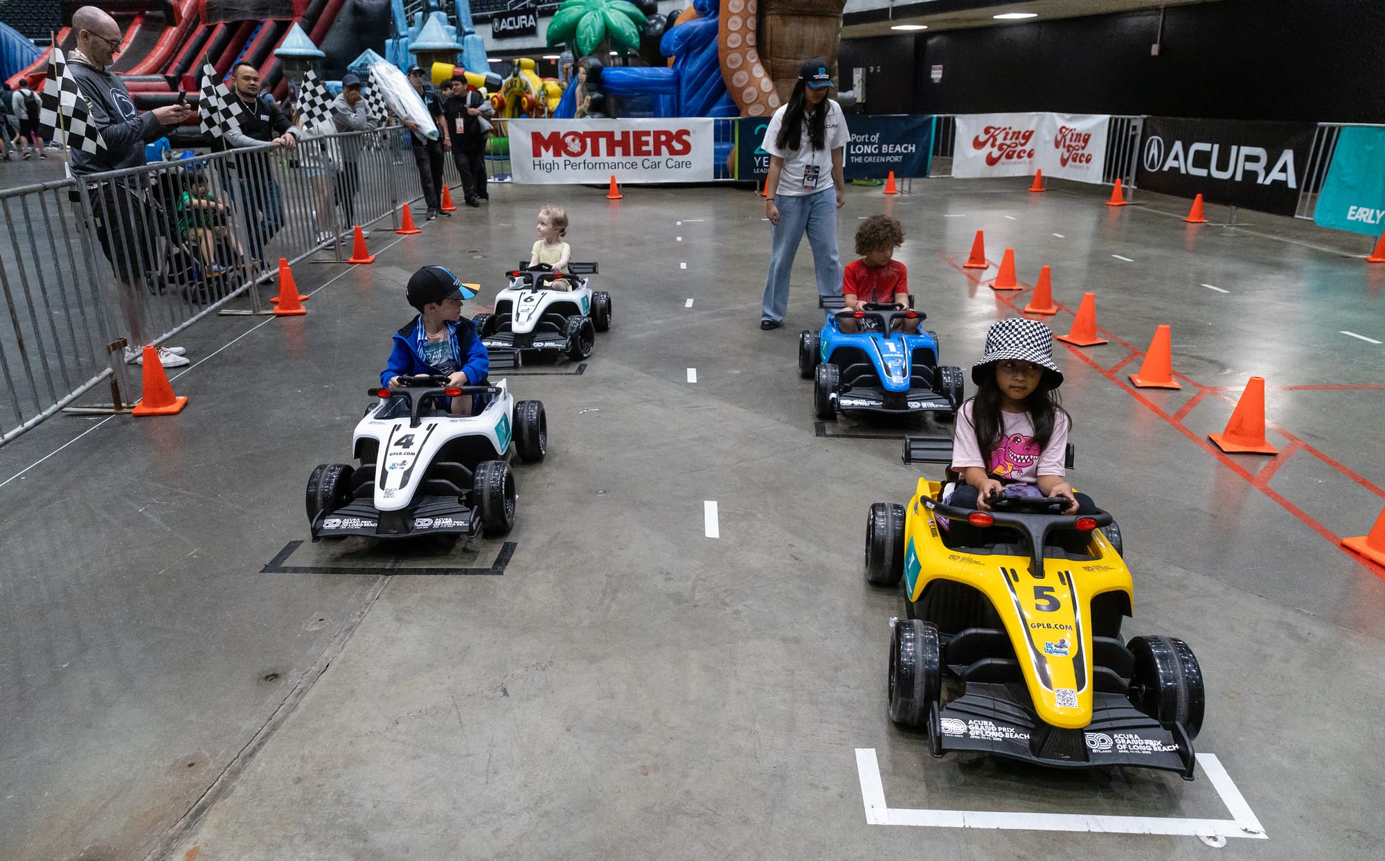 Children prepare to race go-karts.