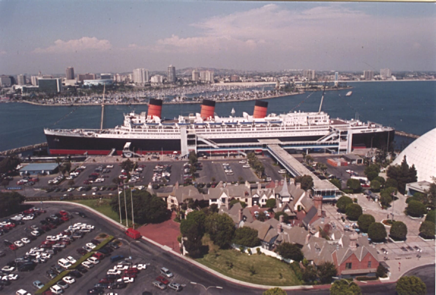 A large ocean liner sits at the dock.