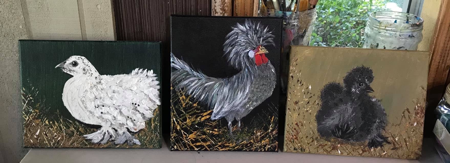 Three paintings of roosters.
