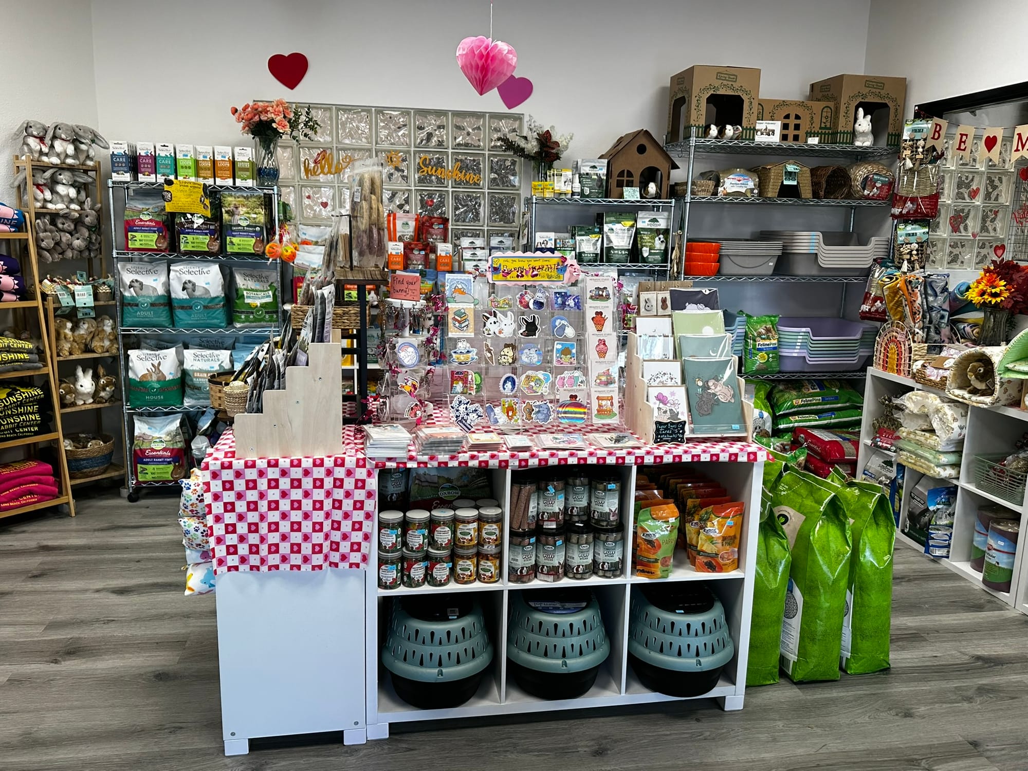 A shop with lots of items on the shelves and tables.