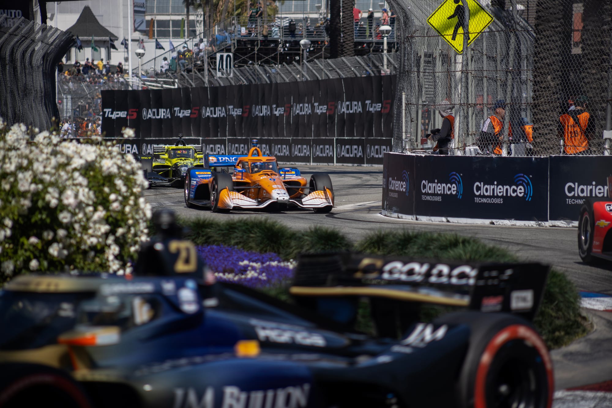 Race cars run along a twisting track.