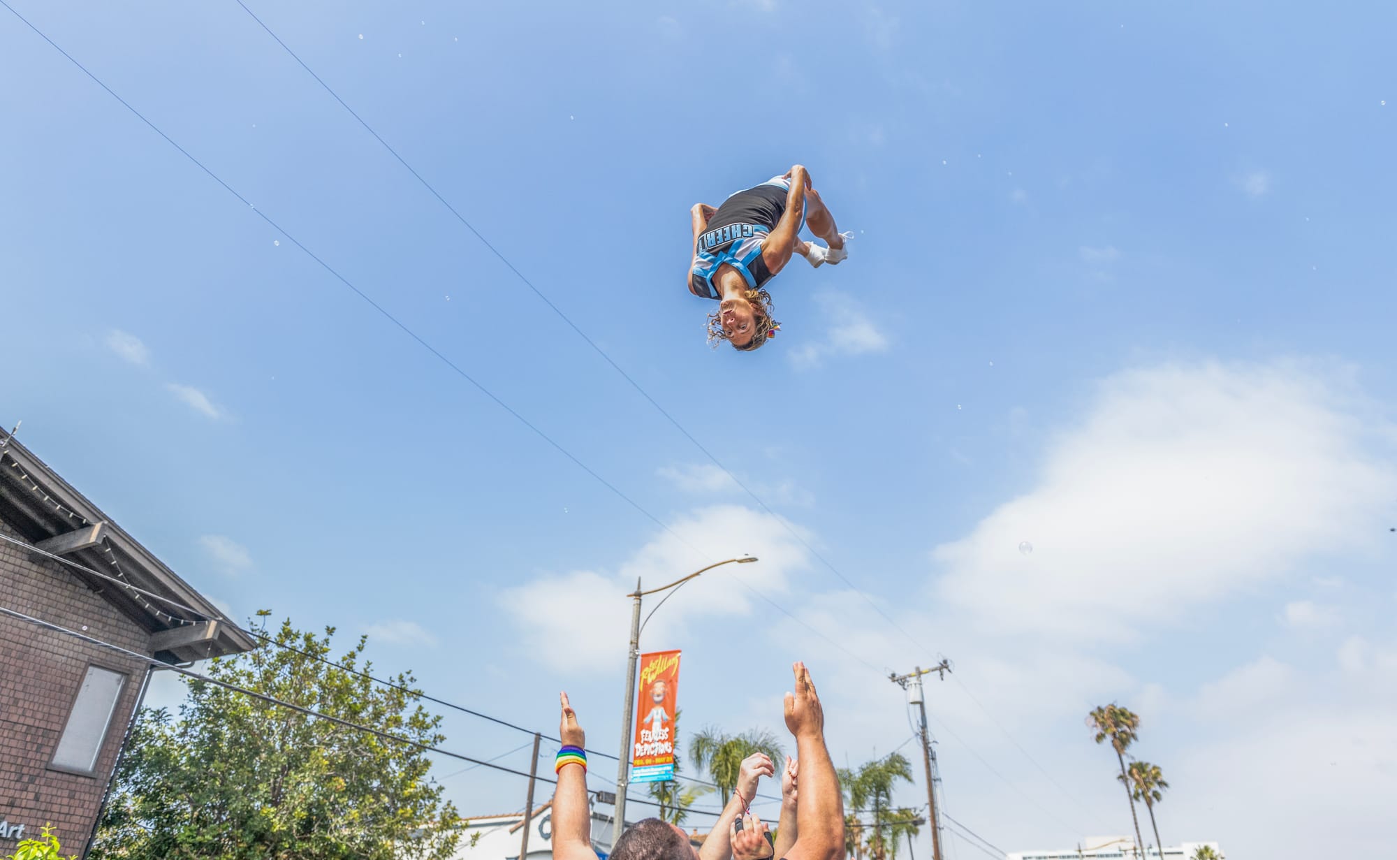 A person does a backflip into the air.