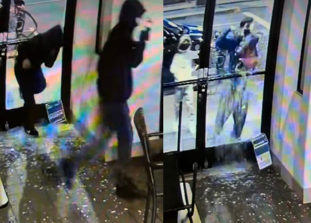 Young boys wearing masks and hoodies break a glass door and walk through.