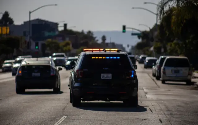 Police arrest 2 suspects in robbery of off-duty cop last month