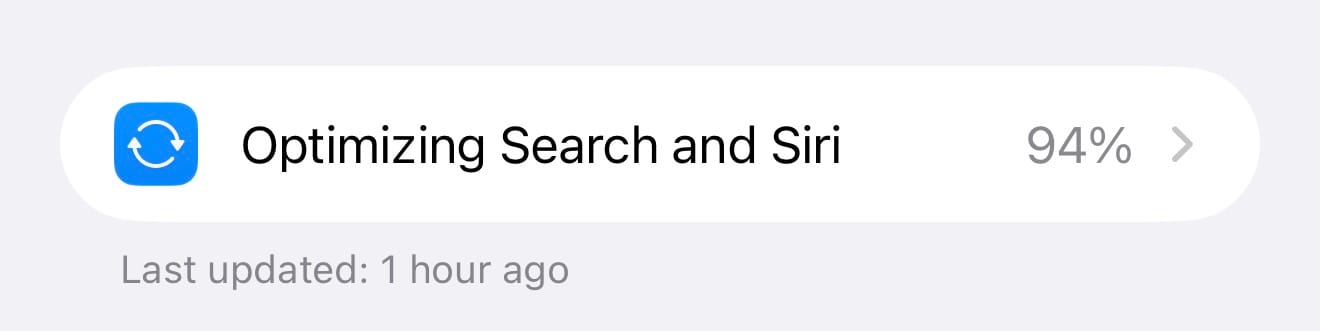 Screenshot of the "Optimizing Search and Siri" row in iOS Settings showing 94% progress and the note "Last updated: 1 hour ago."