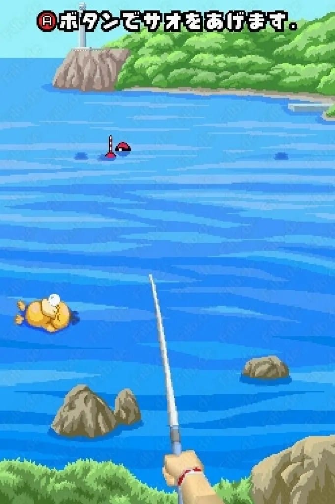 A hand holding fishing rod in front of water.