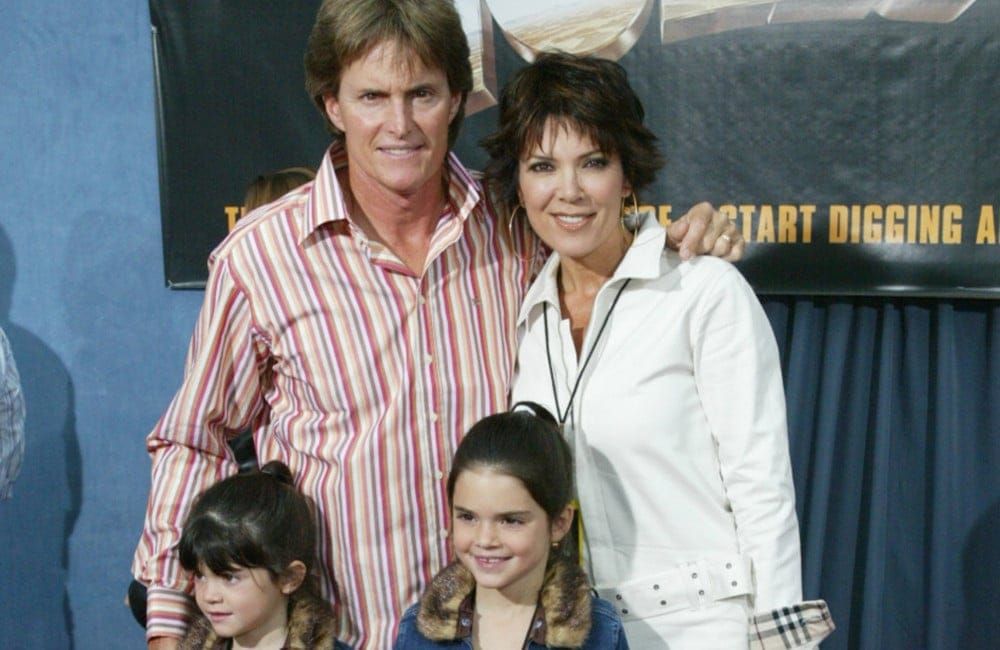 Kendall and Kylie Jenner with parents - matching outfits - 2003 - Holes premiere - Getty