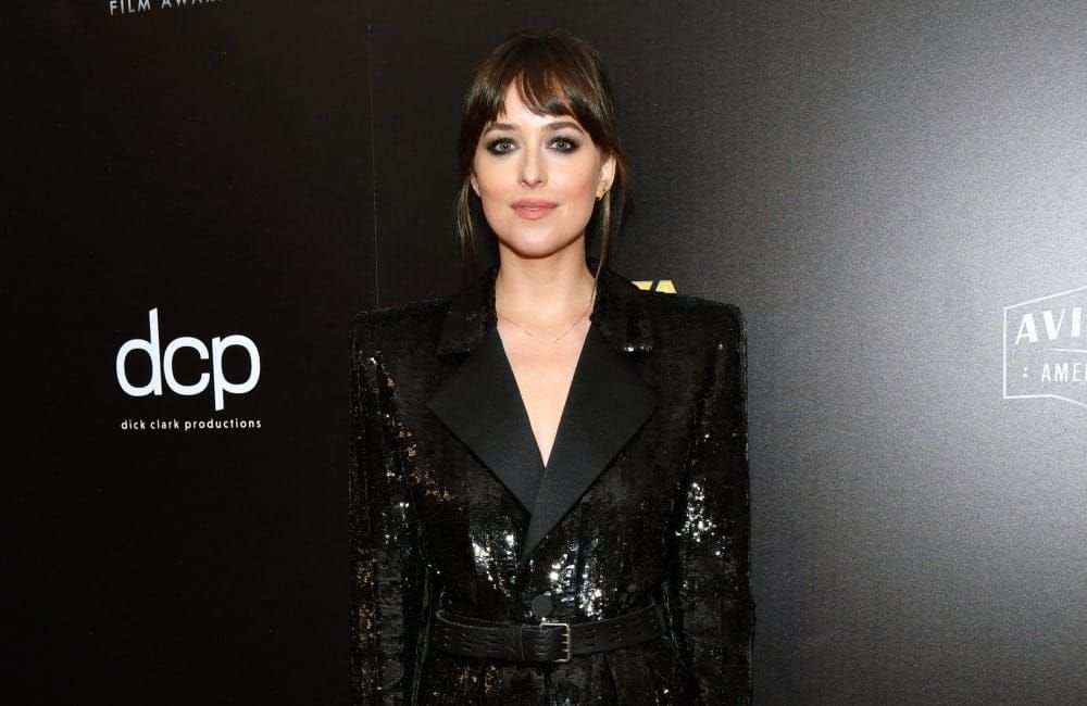 Dakota Johnson poses at Hollywood Film Awards - Getty - Nov 19