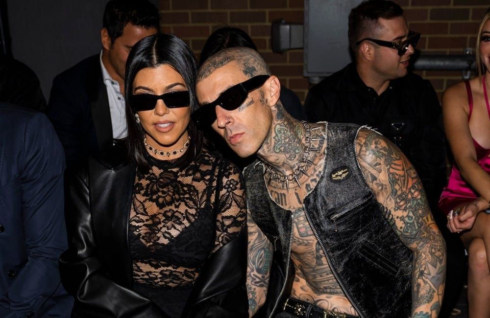 Kourtney Kardashian and Travis Barker  - Boohoo X Kourtney Kardashian fashion show - 2022 - Getty
