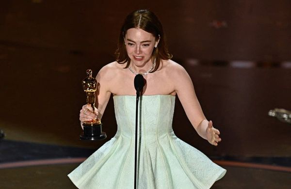 Emma Stone accepts the award for Best Actress in a Leading Role 96th Oscars - Getty