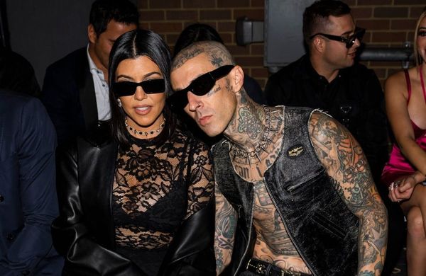 Kourtney Kardashian and Travis Barker  - Boohoo X Kourtney Kardashian fashion show - 2022 - Getty