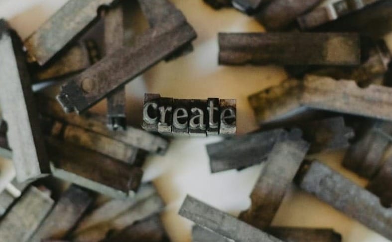 closeup photo of clothespin lot on white surface