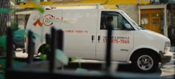 The repairman arrives in a van ready to fix a TV that has problems in the display and audio.