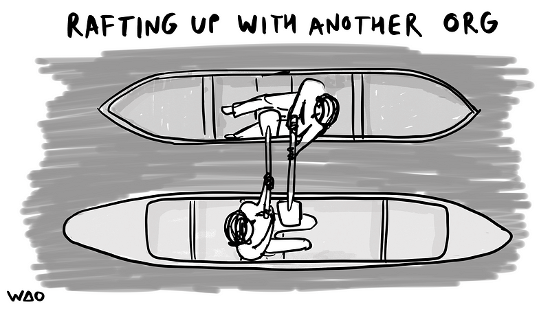 “rafting up with another org” written on top of two canoes with the people holding onto each others oars