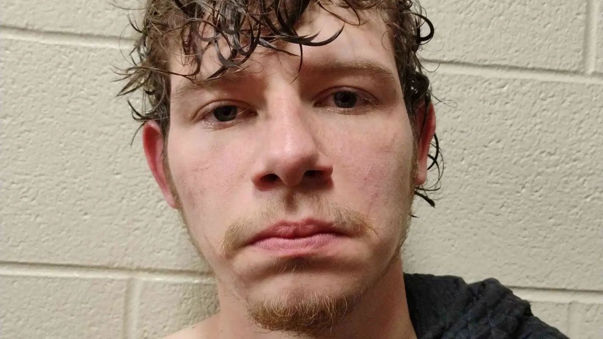 Alleged shooter picks up assault charge after spitting on officer, records show