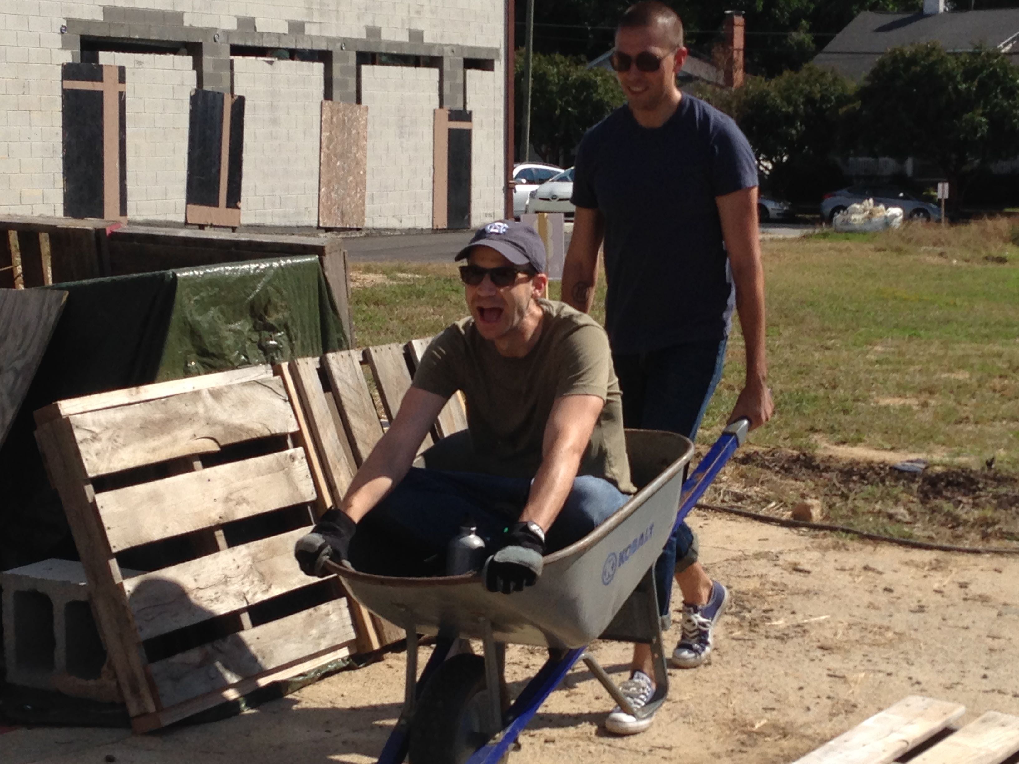 Jonathan getting sherpa-ed around by Matt at Raleigh City Farm (2013).