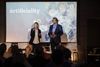 A photo of Helen and Dave Edwards speaking at the Artificiality Summi