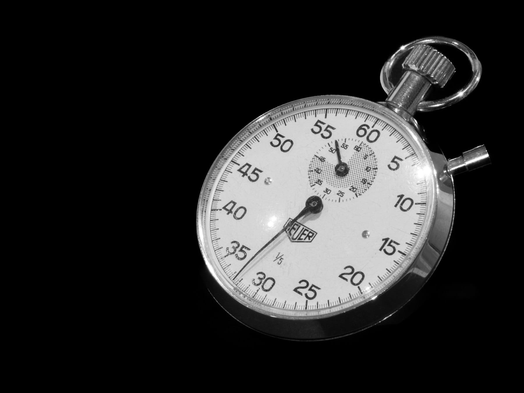 Close up of a mechanical stopwatch on a black background