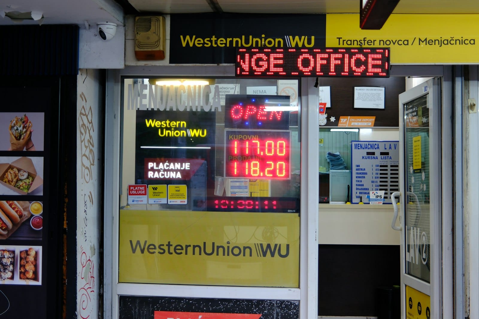 A money transfer and exchange office with an open sign