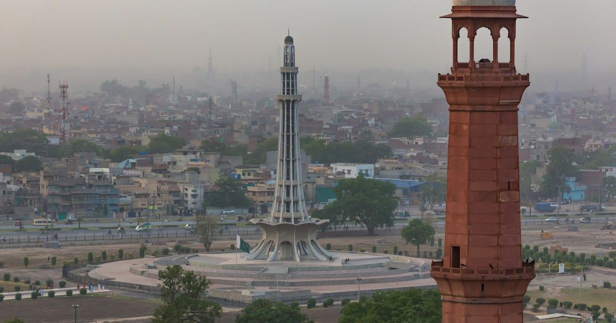 Minar-e-Pakistan and a minaret of the Badshahi Mosque above Lahore
